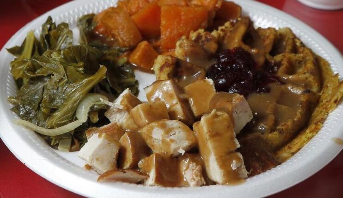 The Thanksgiving 365 — turkey with a stuffing waffle — and sides at Rosako’s Soul Food & BBQ in Bedford