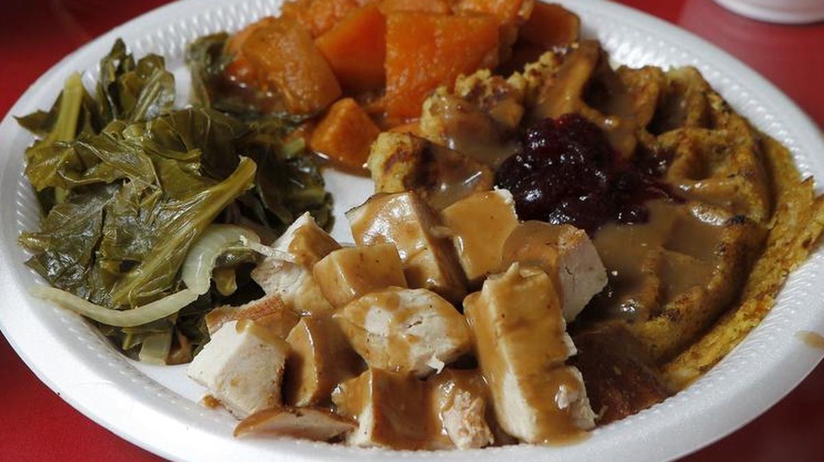 The Thanksgiving 365 — turkey with a stuffing waffle — and sides at Rosako’s Soul Food & BBQ in Bedford