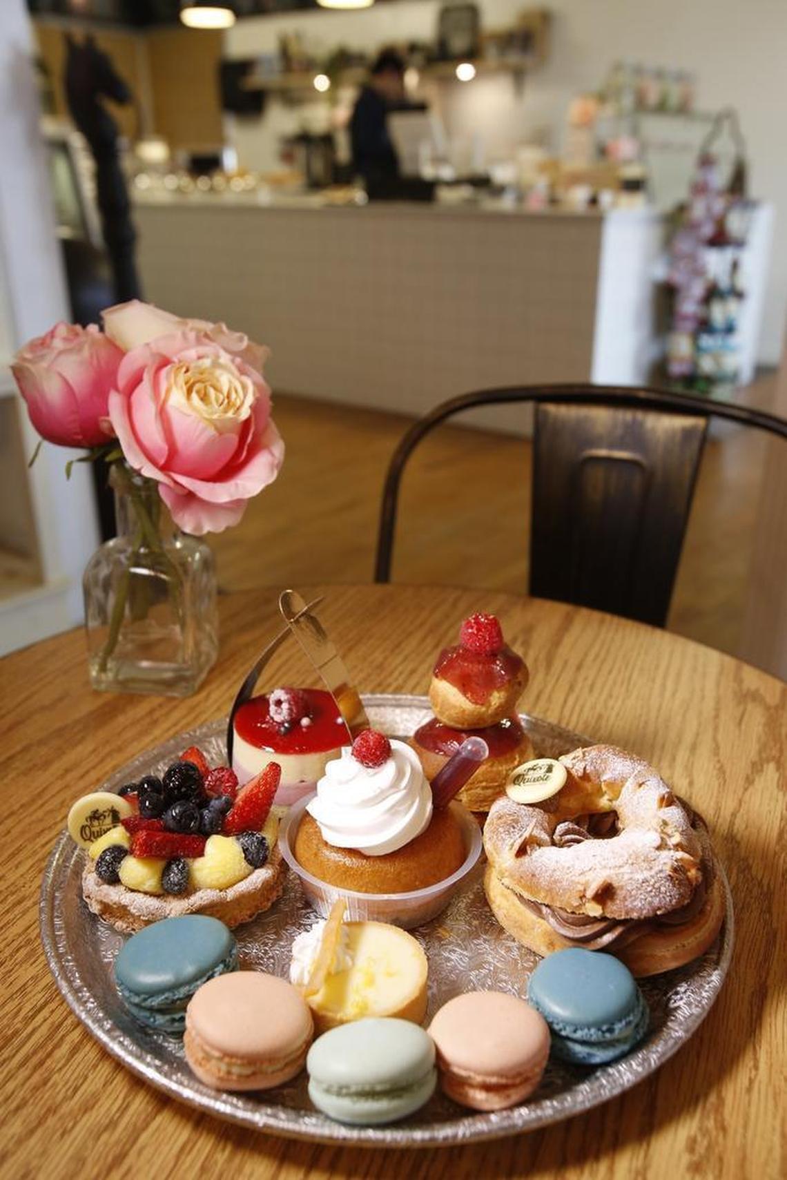 Quixote French pastries (clockwise from left): Tarte dacquoise, petit gateaux, baba au rhum (center), Religieuse, ParisBrest, lemon tarte, assorted macarons