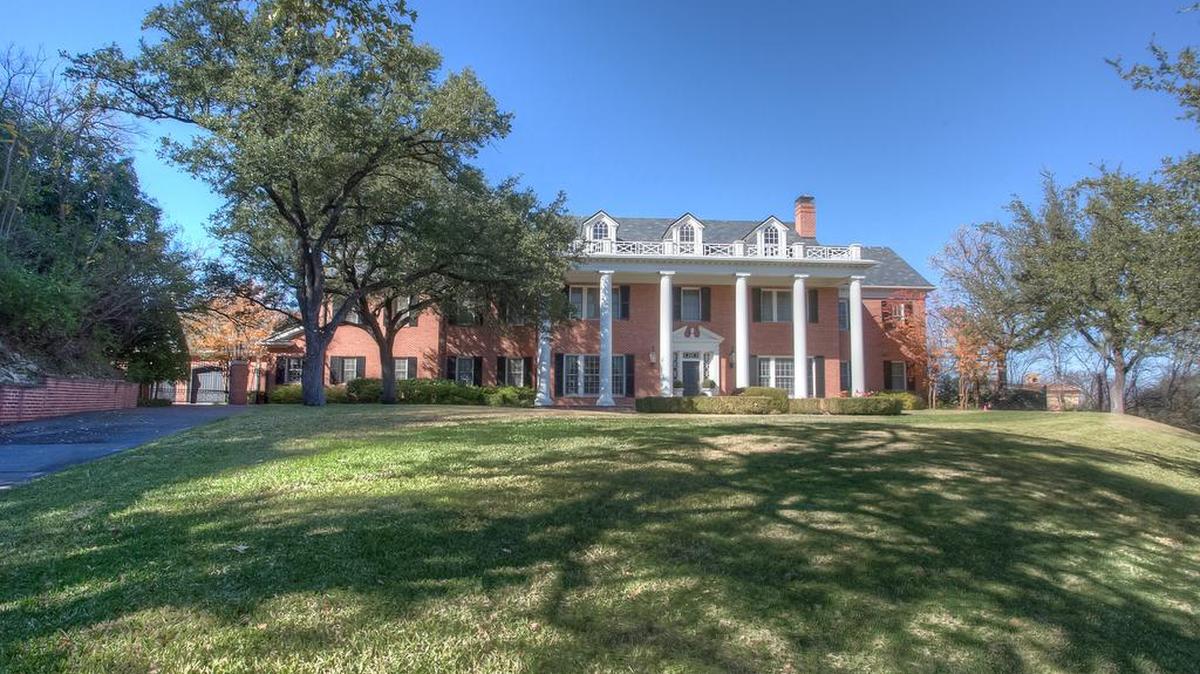 The home at 1120 Pebble Creek Way is located on a two–acre hilltop.