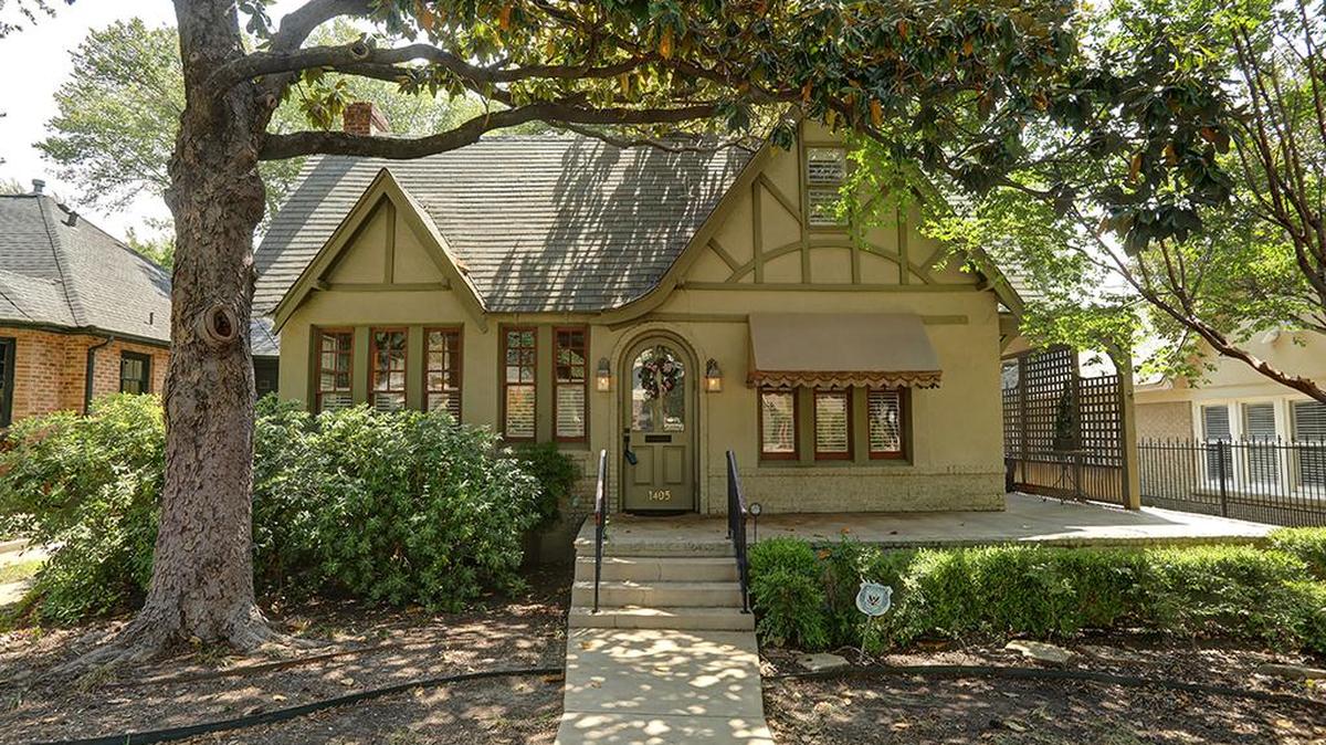 The Tudor-style home at 1405 Clover Lane features two living areas.