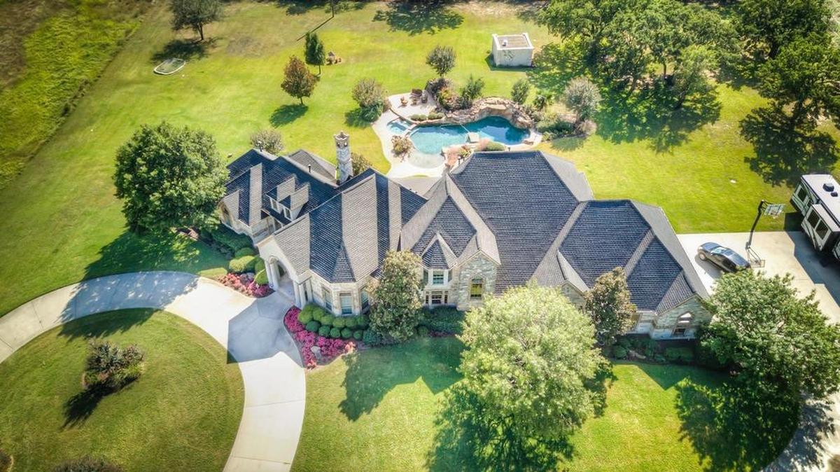 The home at 2380 Preskitt Road is located on 30 acres with rolling countryside and a serene pond.