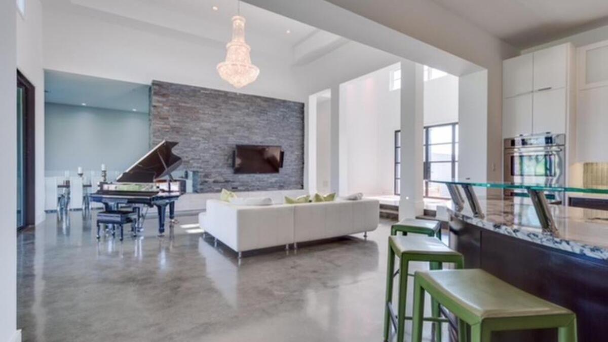 The home at 7951 Bella Flora Drive is priced $1,145,000.