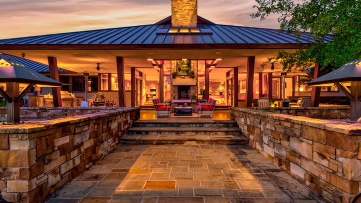 The home at 4808 Bill Simmons Road, with its outdoor fireplace, is priced $3,875,000.