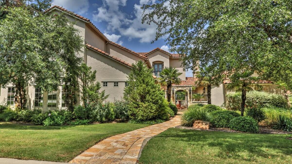 The home at 6501 Saucon Valley Drive greets guests with a lush, manicured lawn.