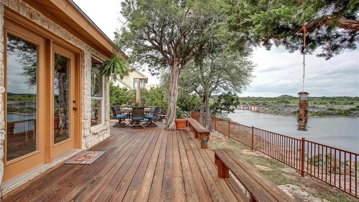 The home at 1009 Bluff Creek Point sits high above the lake on the cliff’s ridge.