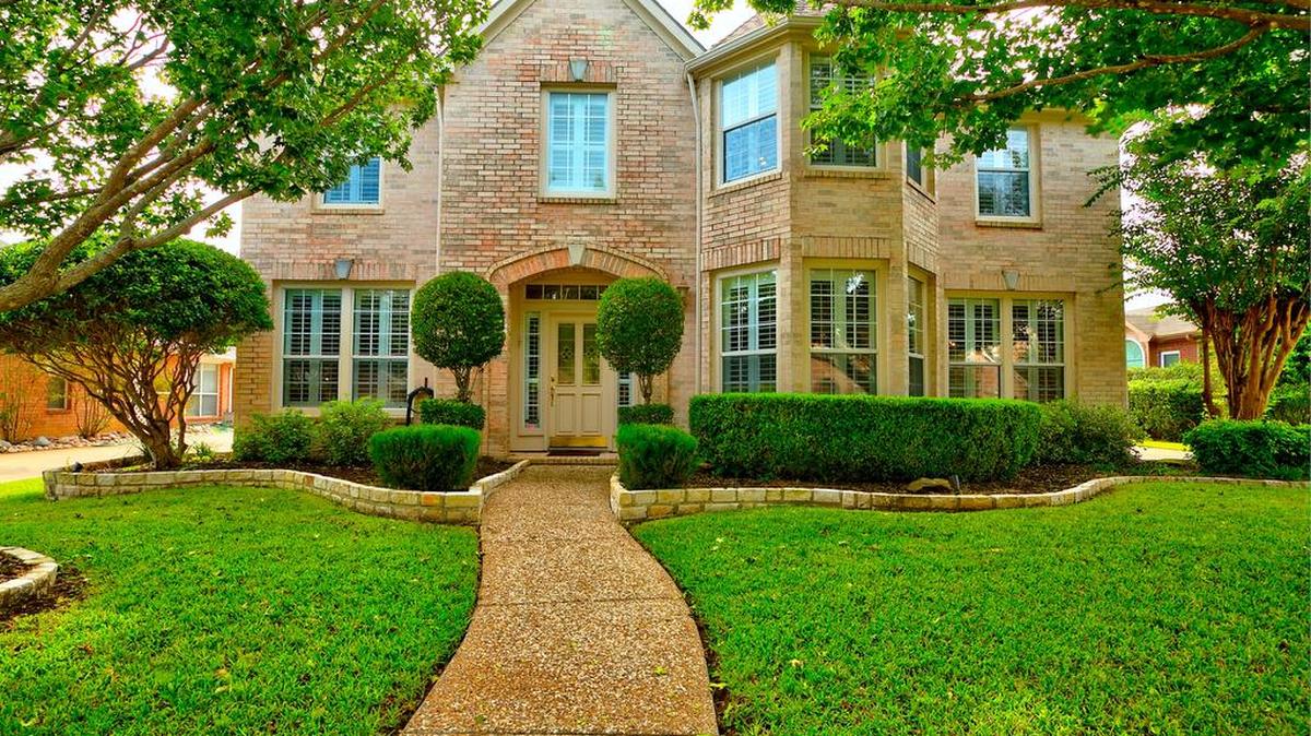 The home at 2814 Country Glen Lane boasts recently installed hardwood flooring on the first level.