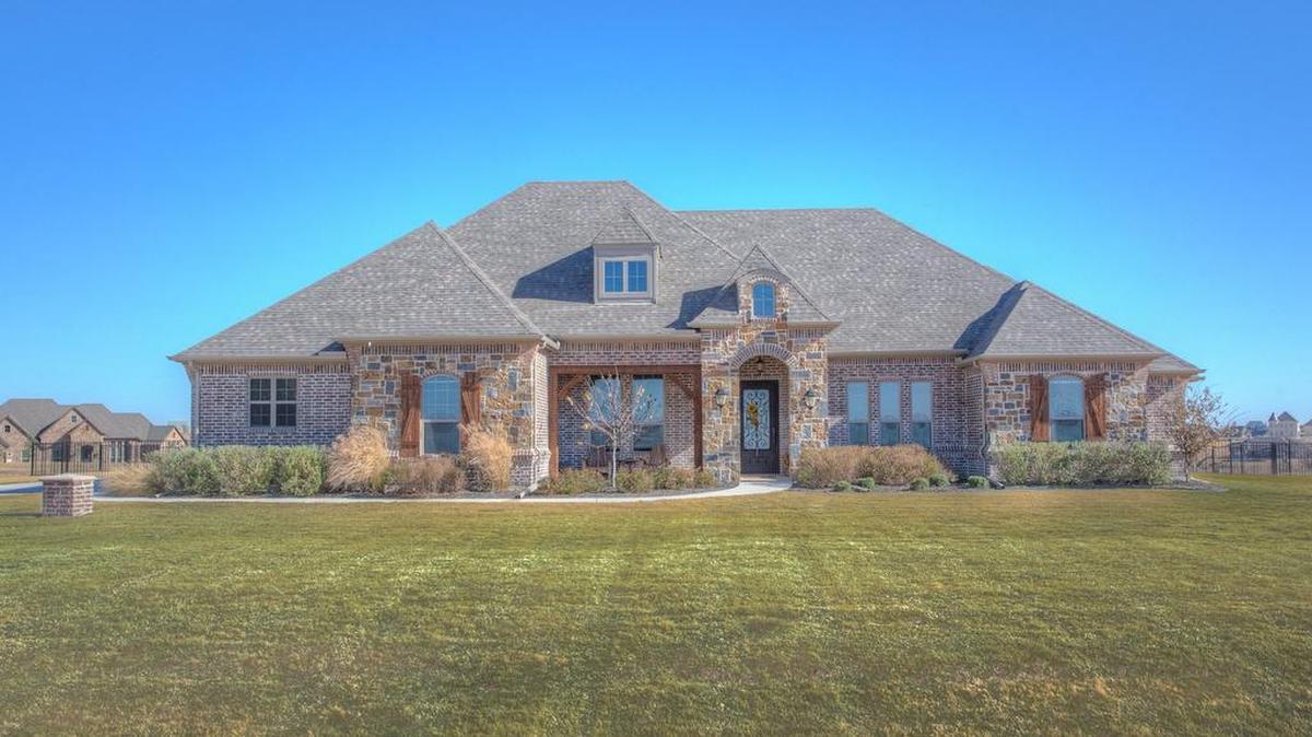 The home at 12125 Bella Palazzo Drive is priced $699,000.