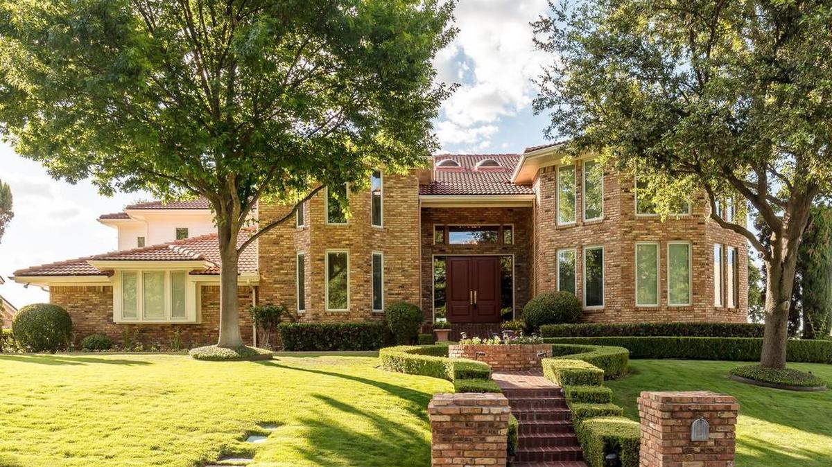 The home at 6103 Woodlake Drive is priced $850,000.