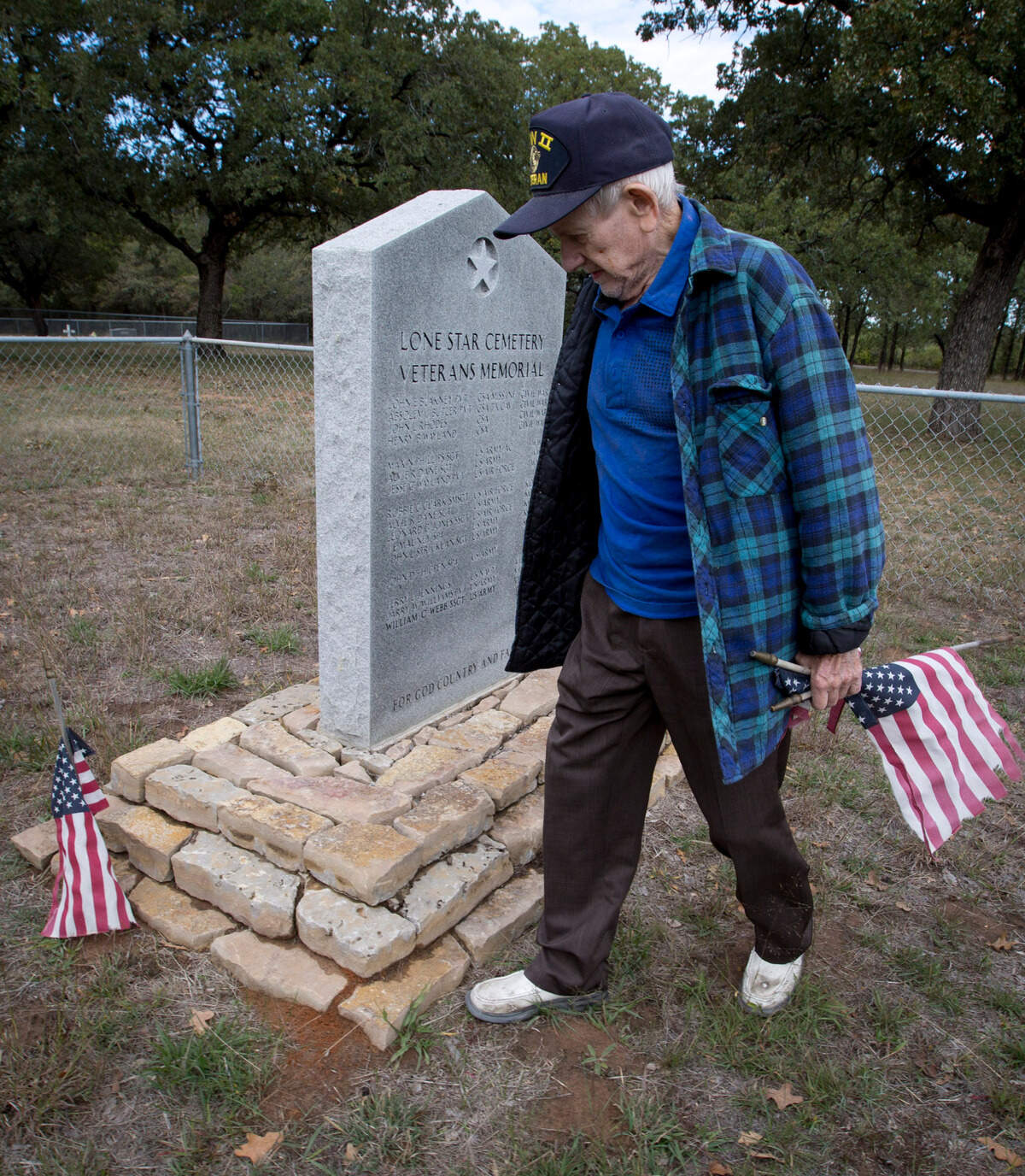 Nov. 6, 2013: Weatherford resident Chuck Katlic is a World War II veteran who took part in the Battle of the Bulge. He gathered weathered flags at Veterans Memorials in Parker County, including Lone Star Cemetery, to replace them with new ones in time for Veterans Day.