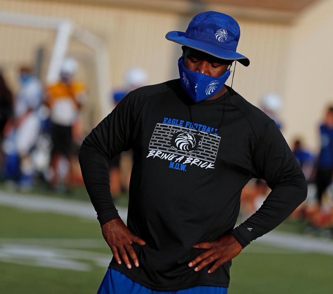 Southwest Christian coach Jeromy Flowers studies the action as his team scrimmages North Side on Thursday at North Side High School in Fort Worth.