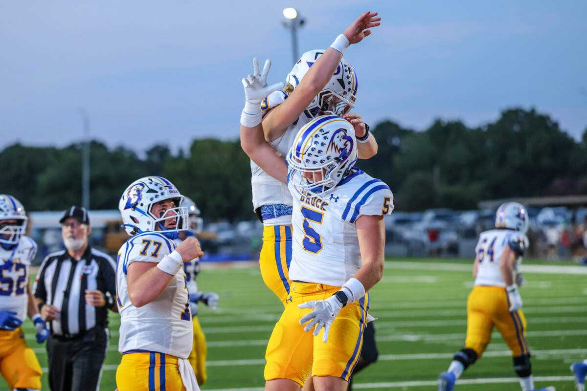 Brock’s Braeden Ray (5) celebrates his touchdown with Holt Frazier (3) in the Eagles’ victory over Fort Worth Southwest on Thursday, Sept. 18, 2025 at Scarborough-Handley Field in Fort Worth, Texas.