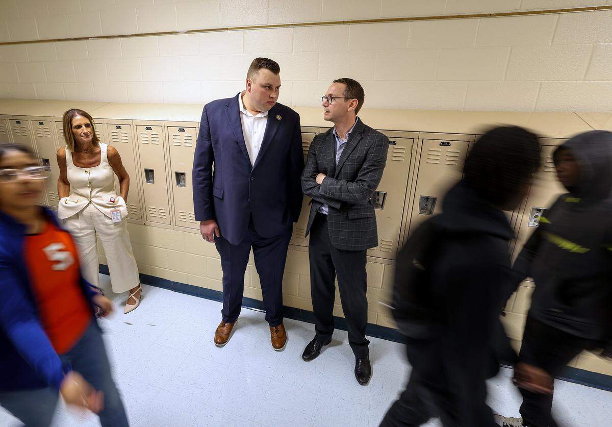 State Education Commissioner Mike Morath, right, talks with State Board of Education Member Brandon Hall while touring William James Middle School on Thursday, Aug. 28, 2025, in Fort Worth.