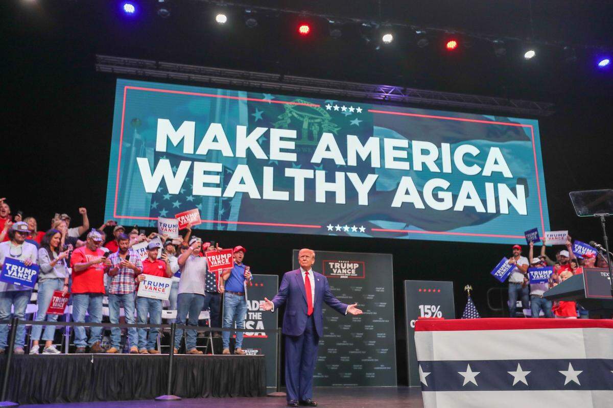 Donald Trump stands on stage at the Johnny Mercer Theater during his first campaign event in Savannah, Georgia, in September. He has promised mass deportations.