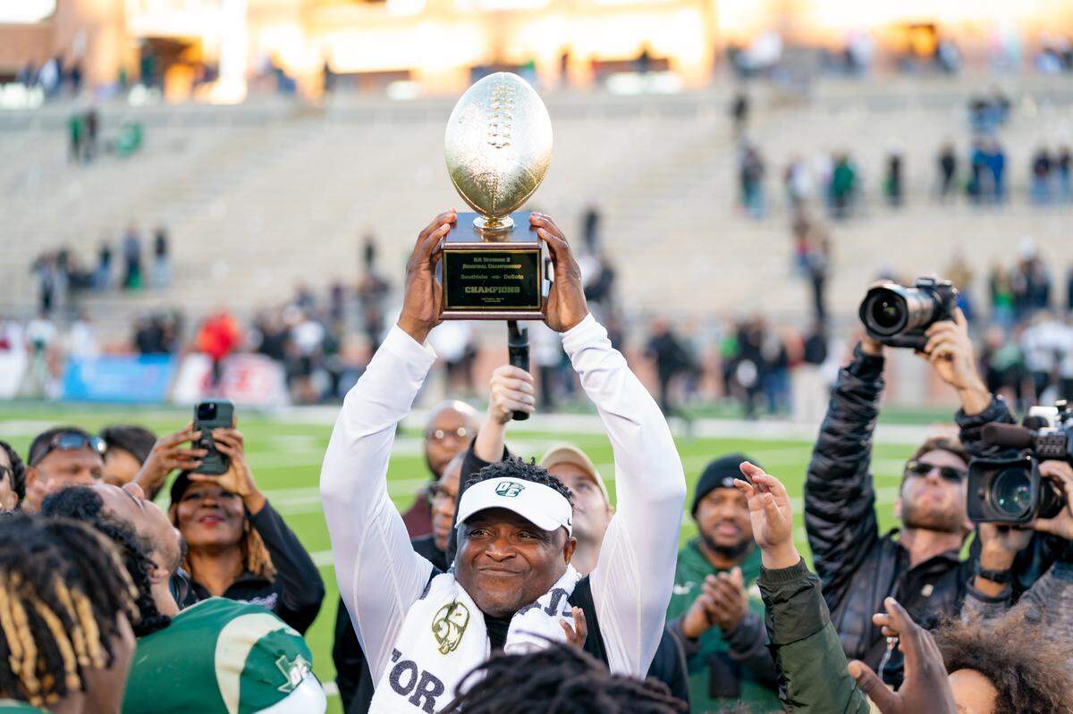 DeSoto head coach Claude Mathis celebrates with his team after a state semifinal win over Southlake Carroll on Dec. 9, 2023, in Allen.