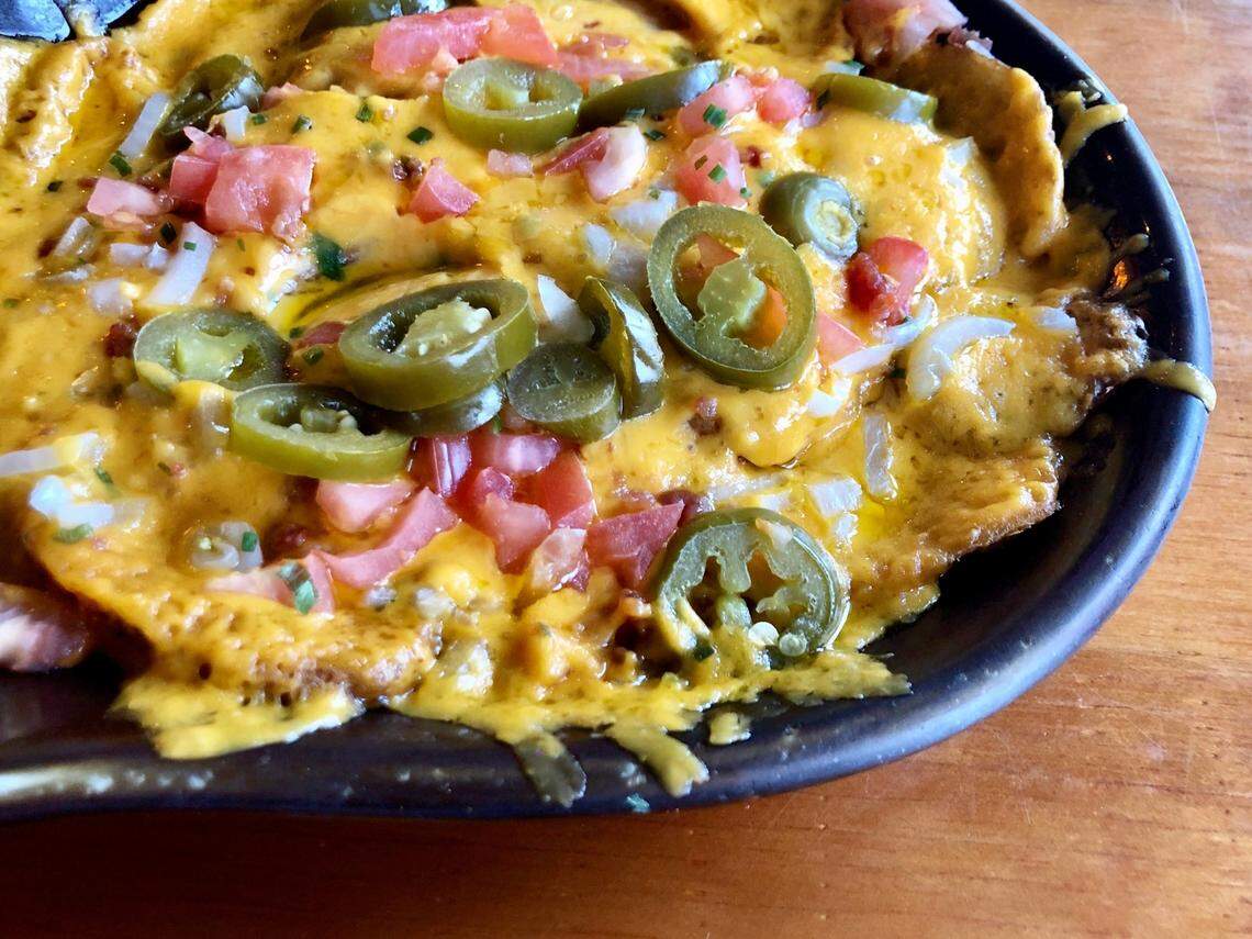 J. Gilligan’s Bar & Grill in Arlington popularized “Irish nachos” served on cottage fries instead of chips.