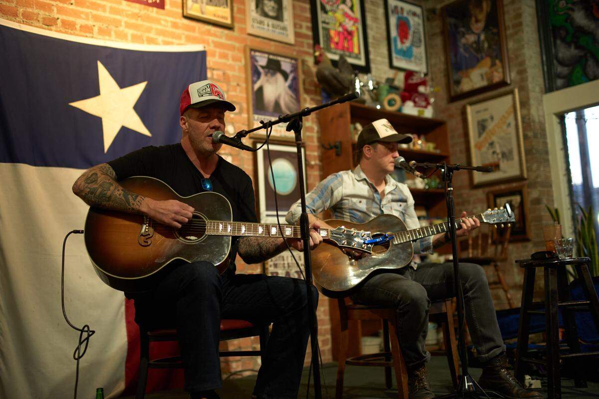 Ward Richmond, left, performs with longtime friend and bandmate John Pedigo at the AllGood Cafe in Dallas. Pedigo, an acclaimed Dallas producer, produced Richmond’s new album, Big Addict Energy, due out on Nov. 21.