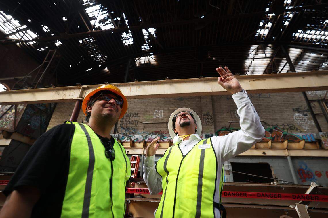 Carlos Gonzalez-Jaime, executive director fo Transrom 1012 N. Main Street, right, talks with architect Dennis Chiessa while touring the Fred Rouse Center for Arts and Community Healing on Tuesday, Aug. 26, 2025.