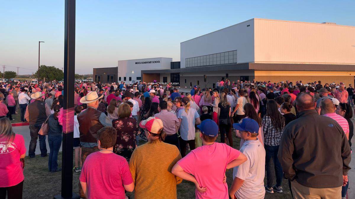 Hundreds gather at Brock Elementary School Tuesday evening for prayers, hymns and a candlelight vigil for the Parker County 6-year-old girl who was killed by a school bus Monday afternoon.