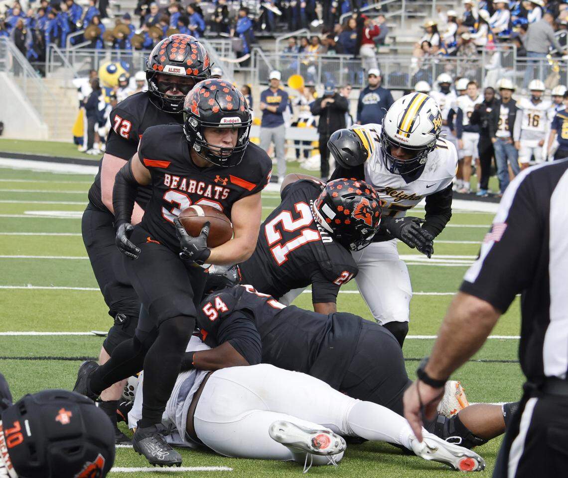 Aledo running back Brady Powell (39) goes in for six against Fort Worth Arlington Heights during the first half of a UIL Class 5A Division I Regional on Friday Nov. 28, 2025 at Crowley ISD Multi-Purpose Stadium in Fort Worth, Texas.