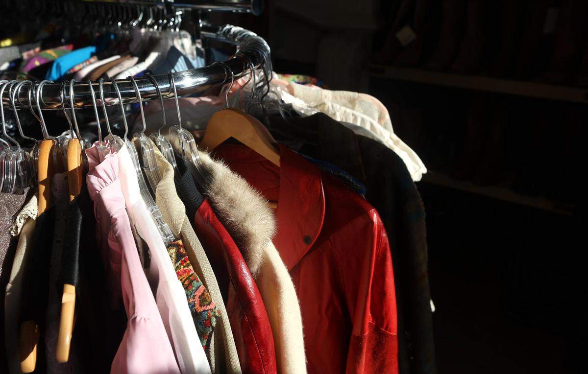 Vintage clothing hangs from a rack at Studio 74 Vintage in Fort Worth on Thursday, Dec. 23, 2021. Laura Simmons is the owner of the boutique shop that sells curated vintage clothing.