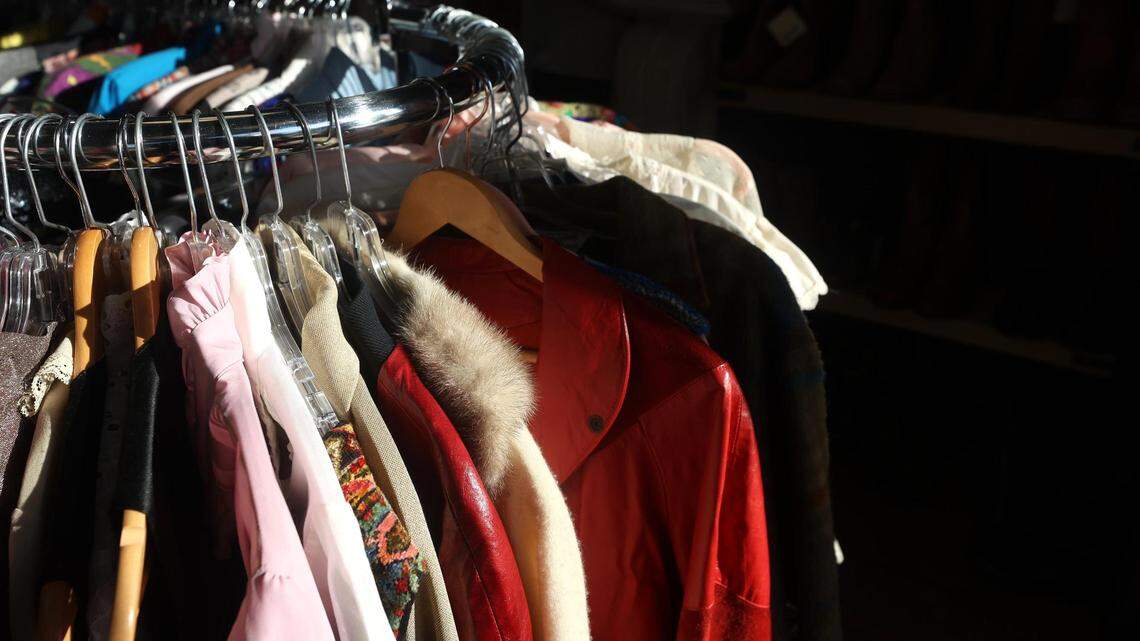 Vintage clothing hangs from a rack at Studio 74 Vintage in Fort Worth on Thursday, Dec. 23, 2021. Laura Simmons is the owner of the boutique shop that sells curated vintage clothing.
