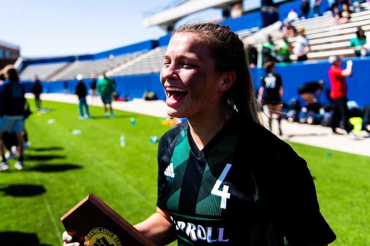 Kenzi Tufts celebrates with the Regional Championship trophy after beating Flower Mound Marcus 2-0 at McKinney ISD Stadium on April 9th, 2022.