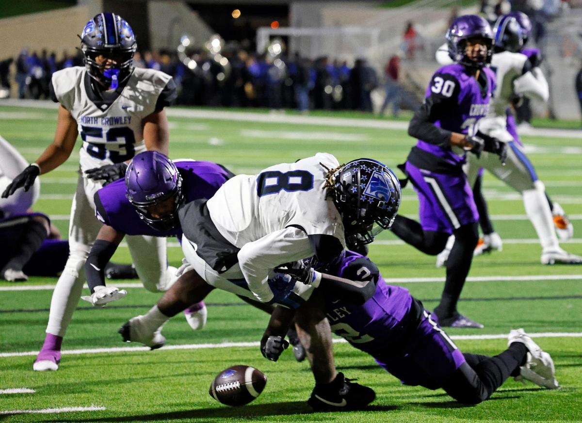 North Crowley running back Ashton Searl (8) is hit by Crowley free safety Donovan Blake (2) and fumbles near the goal line in the first half of a UIL high school football game at Crowley ISD Multi-Purpose Stadium in Fort Worth, Texas, Thursday, Nov. 02, 2023.