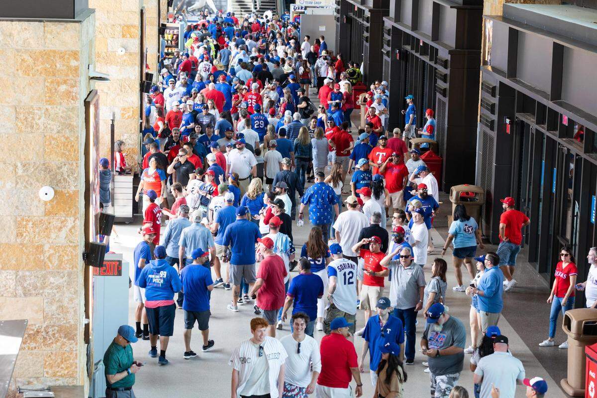Fans crowd the main concourse for the Texas Rangers opening day game Monday, April 11, 2022, at Globe Life Field in Arlington.