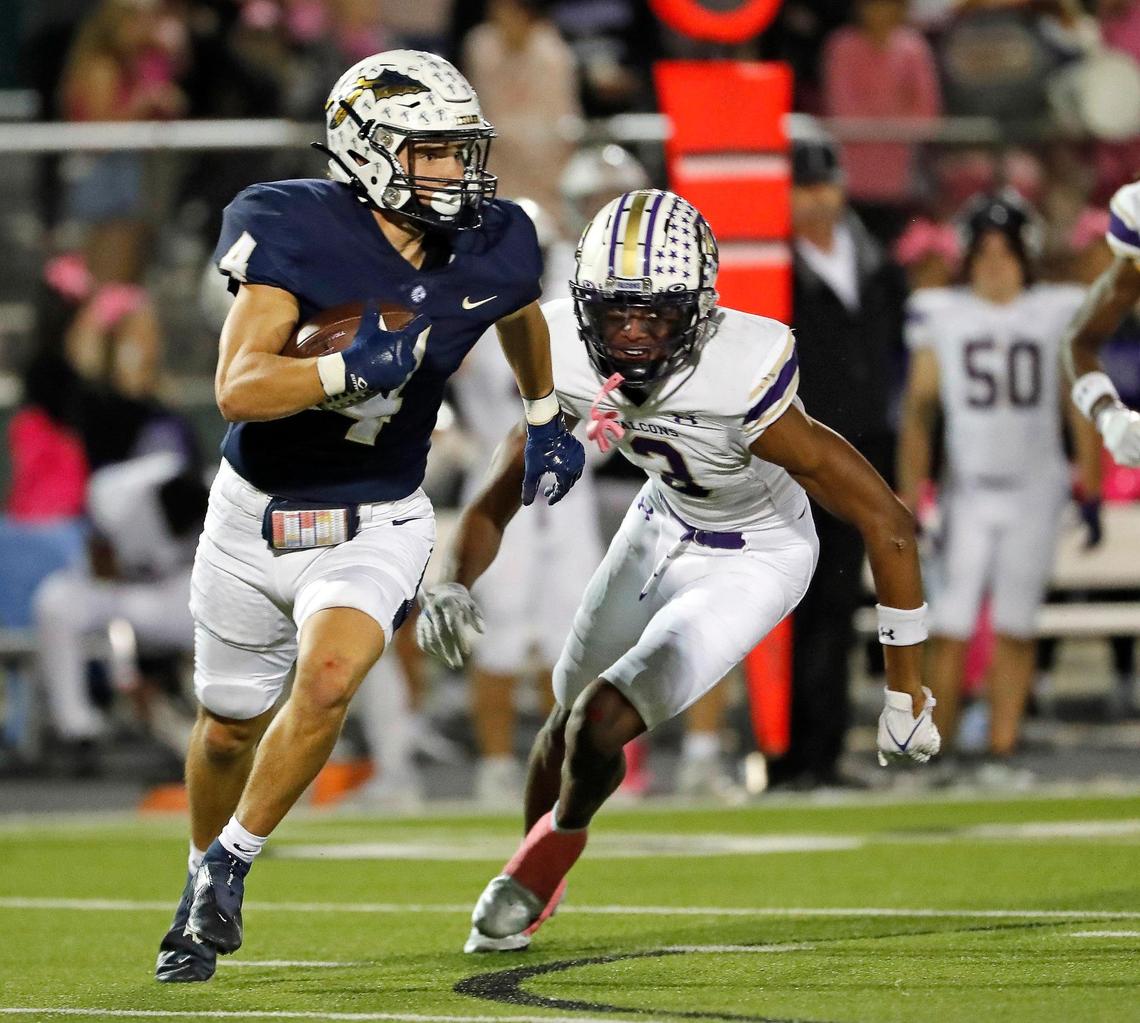 Keller defensive back Eli Brinton (4) is pursued by Timber Creek wide receiver Chukwudozie Ezukanma (3) in the second half of a District 4-6A high school football game at Keller ISD Stadium in Keller, Texas, Thursday, Oct. 27, 2022. Keller defeated Timber Creek 39-17. (Special to the Star-Telegram Bob Booth)