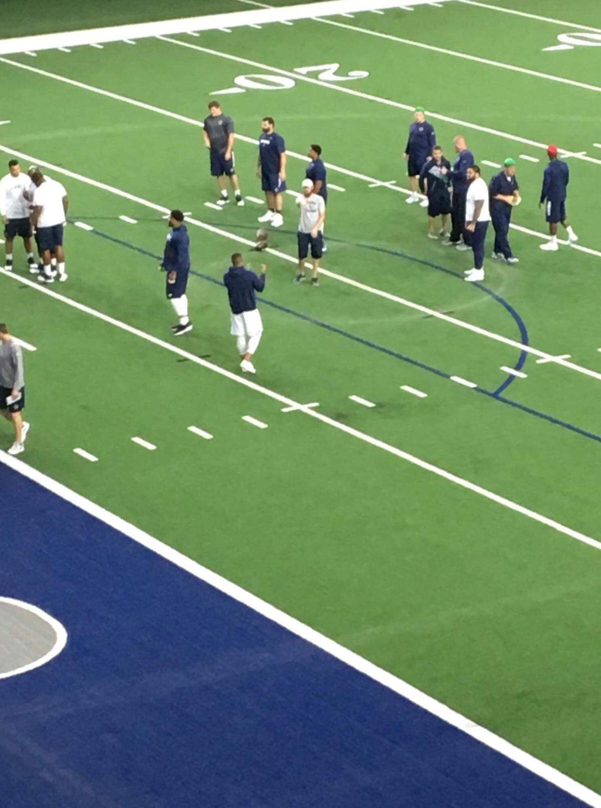 A view of a Dallas Cowboys practice from inside one of the Frisco Omni Hotel meeting rooms. When the Cowboys go inside The Ford Center at The Star, it’s supposed to be a closed practice. So much for that.