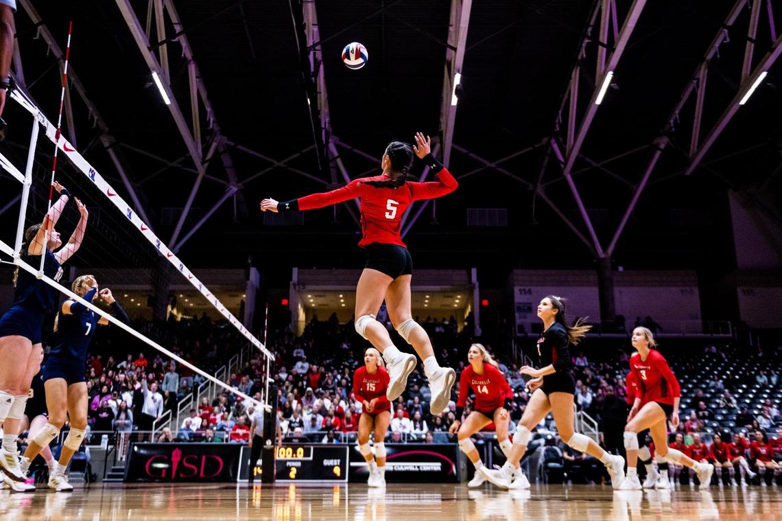 Suli Davis hits during the 5A state semifinal between Colleyville Heritage and Montgomery Lake Creek at the Curtis Culwell Center in Garland on November 18th, 2022.