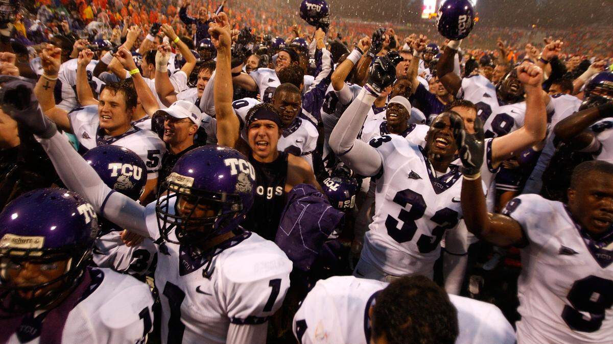 The TCU Horned Frogs celebrate after a 14-10 victory over the Clemson Tigers during their game at Memorial Stadium on September 26, 2009 in Clemson, South Carolina. Since that game, both programs steadily climbed over the last 10 years.