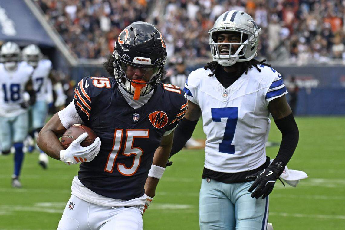 Sep 21, 2025; Chicago, Illinois, USA; Chicago Bears wide receiver Rome Odunze (15) catches a touchdown pass against Dallas Cowboys wide receiver Traeshon Holden (7) during the first half at Soldier Field. Mandatory Credit: Matt Marton-Imagn Images
