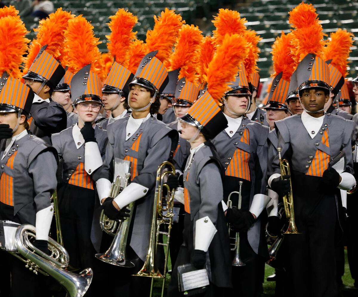 The Aledo Bearcat Band prepares to take the field for their halftime show after the first half of a Conference 5A Division 1 UIL Regional football playoff game at Choctaw Stadium in Arlington, Texas, Friday, Oct. 24, 2023.