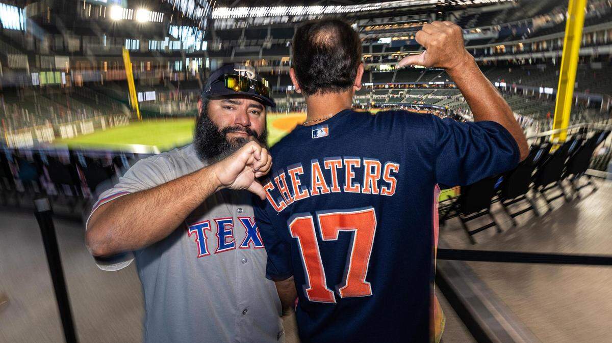 Joe Palacios, left, and Armando Contreraz show their displeasure for the Houston Astros prior to game three of the ALCS between the Texas Rangers and the Houston Astros at Globe Life Field in Arlington on Wednesday, Oct. 18, 2023.