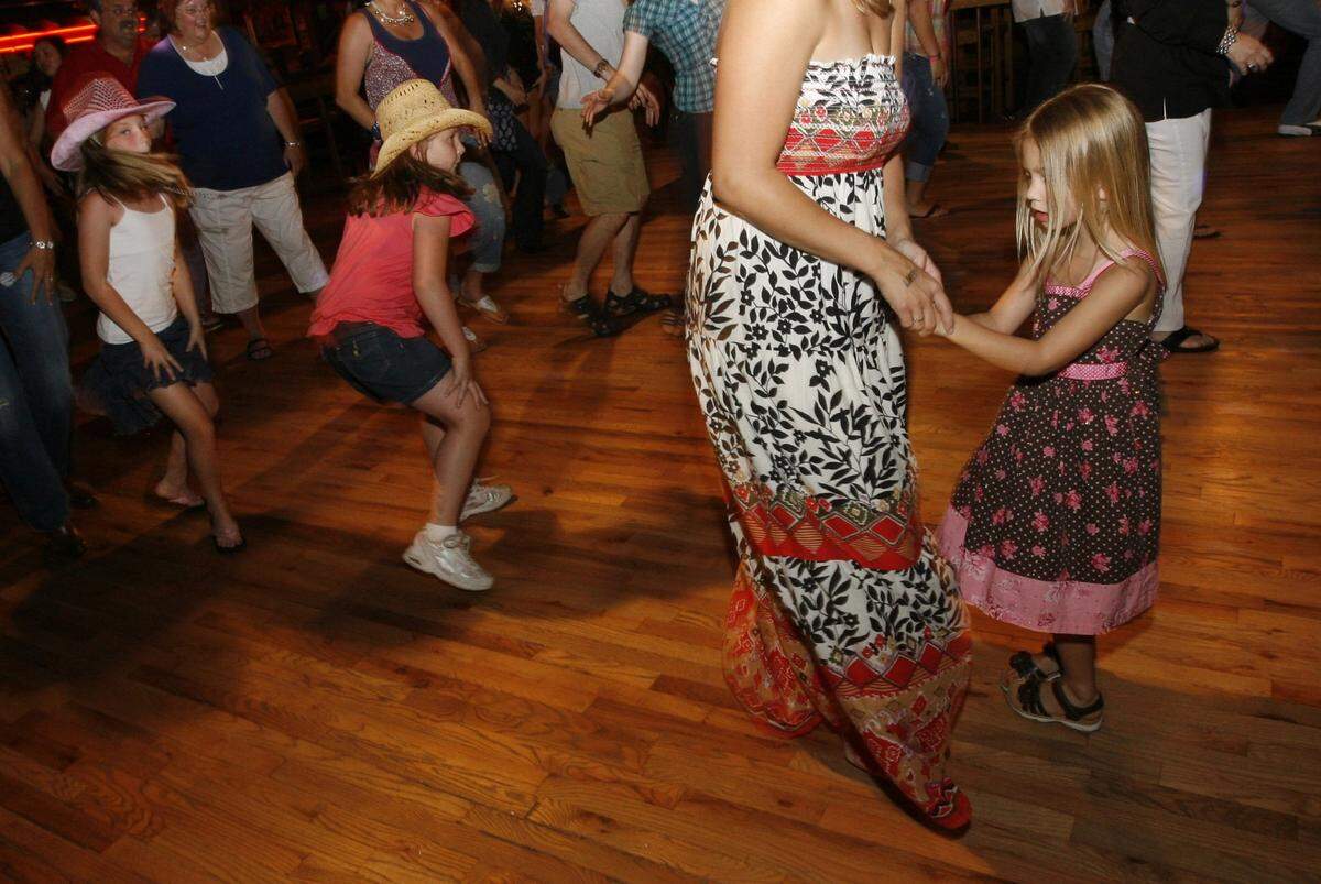 June 12, 2010: From left, Kennedy Kasten, Sarah DeNeve, Sarah Hobson and Kassidee Hobson dance at Billy Bob’s Texas in the Fort Worth Stockyards.