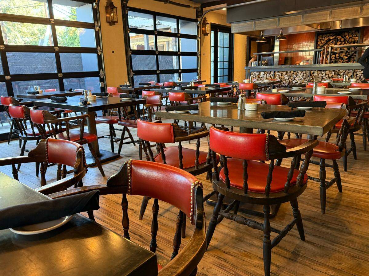The new dining room at Cattlemen’s Fort Worth Steak House features large windows and a view of the future patio, still under construction in Fort Worth on Oct. 19, 2024.