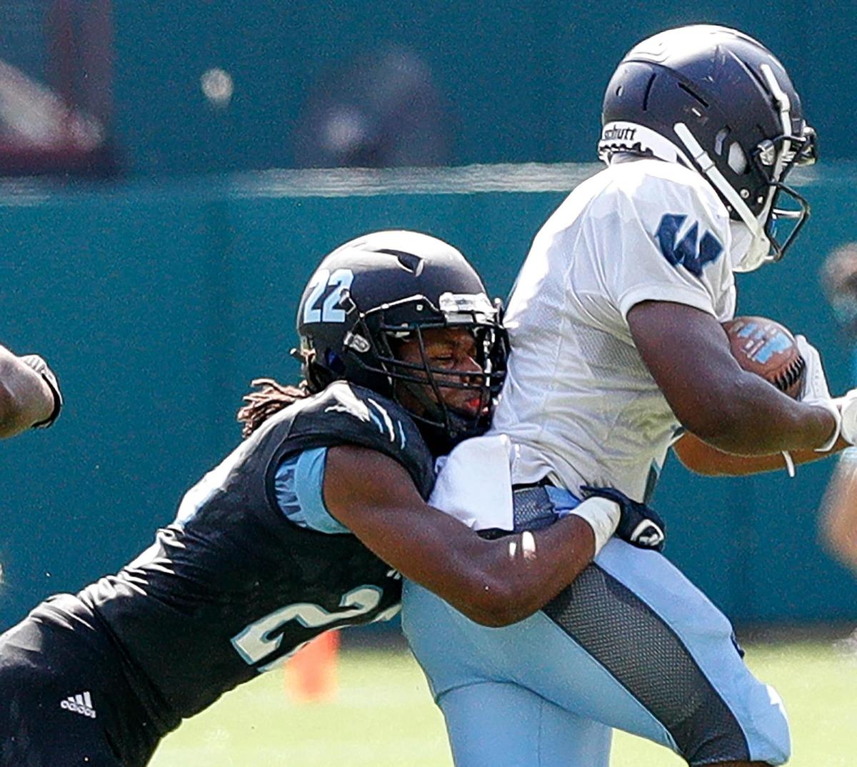 Arlington Seguin linebacker Seth Clay-Johnson (22) makes a stop on O.D. Wyatt running back Tamadre Ross during the first half, Saturday afternoon, Sepember 26, 2020 played at Globe Life Park in Arlington, TX (Steve Nurenberg Special to the Star-Telegram)