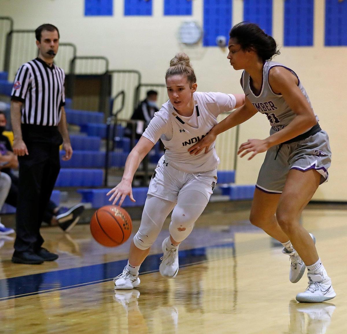 Keller guard Cambridge Mathews (2) drives the ball against Timber Creek forward Maya Linton (21) in the second half of a 4-6A district high school girls basketball game at Keller High School in Keller, Texas, Thursday, Jan. 28, 2021. Keller defeated Timber Creek 56-49. (Special to the Star-Telegram Bob Booth)