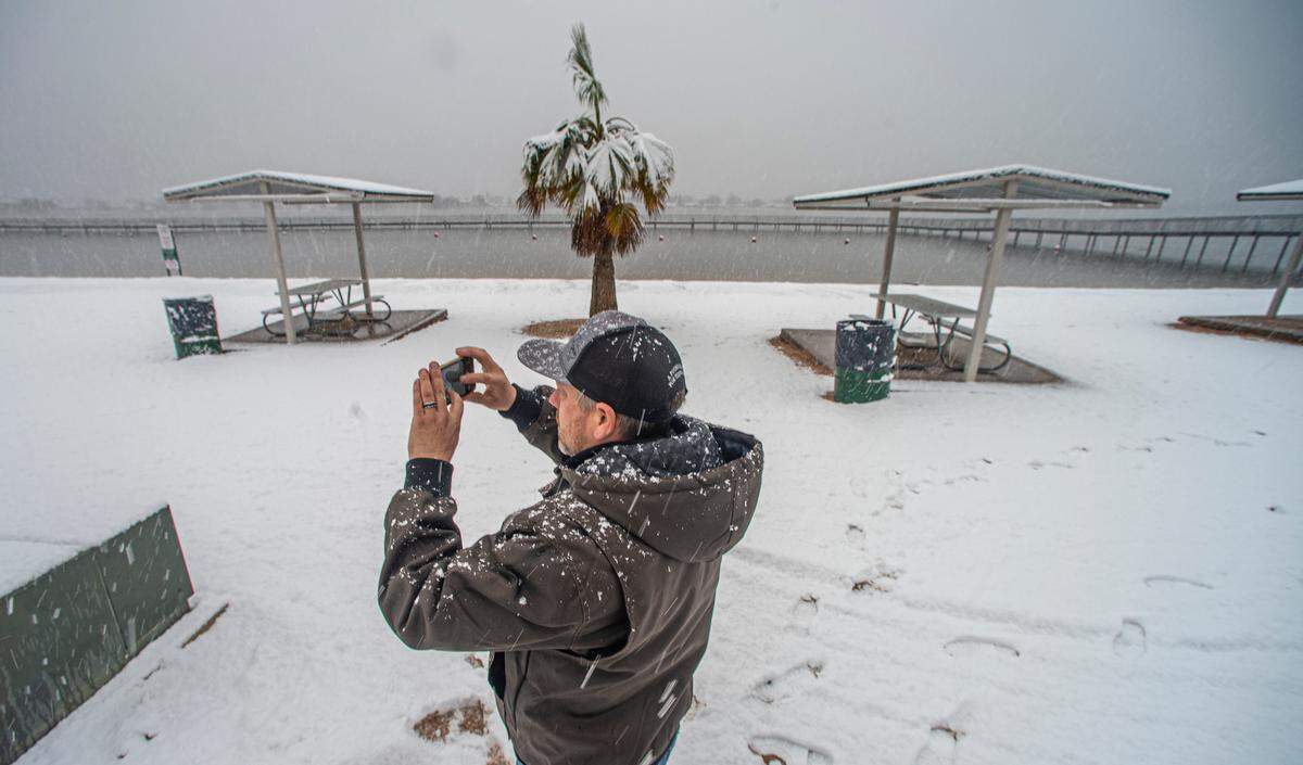 Chad Wallen took pictures of a snow covered Granby City Beach Jan. 10, 2021. The palm tree that has been a feature of the park has since died after the extended freeze a month later.
