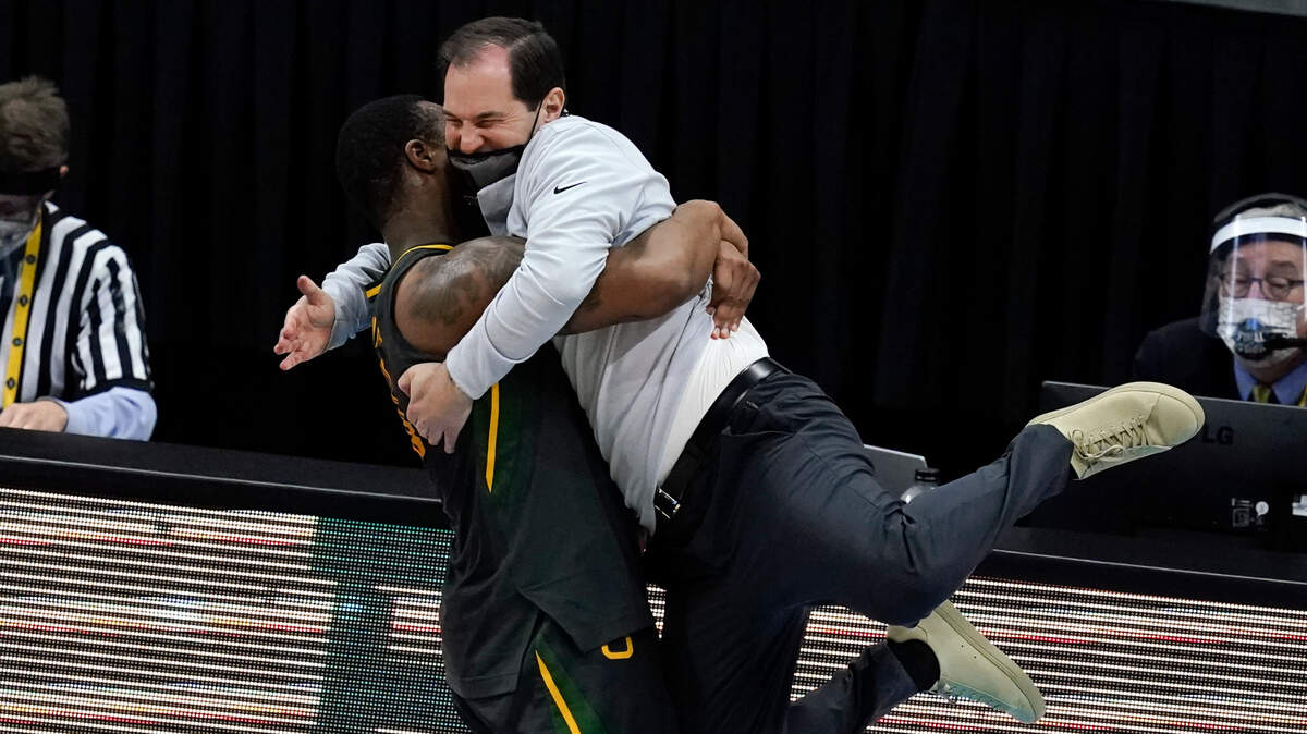 Baylor head coach Scott Drew gets a hug from guard Mark Vital at the end of the championship game against Gonzaga Monday night in Indianapolis.