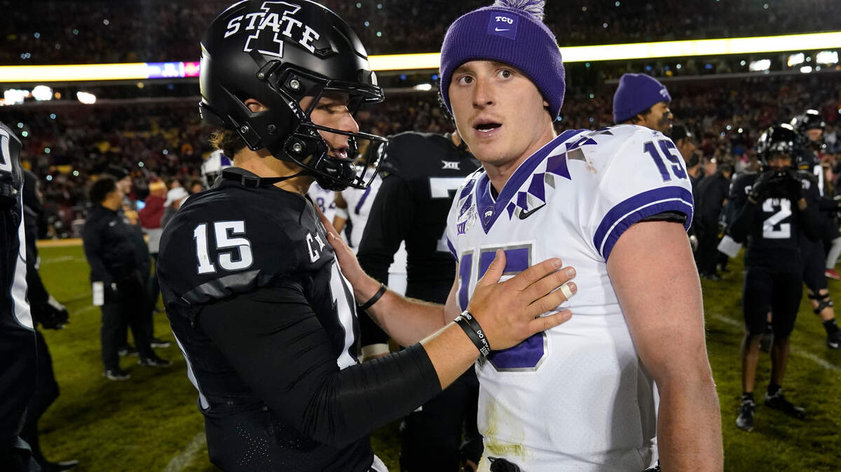 Iowa State quarterback Brock Purdy (15) talks with TCU quarterback Max Duggan (15) after their 2021 game. The Horned Frogs will be looking to snap a three-game losing streak against the Cyclones on Saturday.