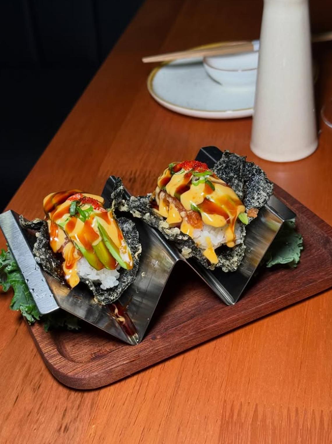 The spicy tuna tacos are filled with spicy tuna, avocado, spicy mayo, kabayaki sauce, red tobiko and scallion at Silver Sea Sushi Flower Mound.