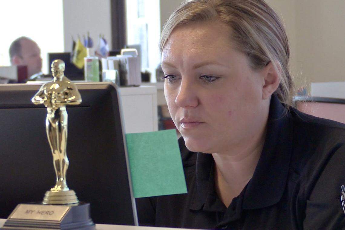 Fort Police Department Crisis Intervention Team officer Kelly French sits at her desk looking through 911 calls on Jan 23. for mental health related calls.