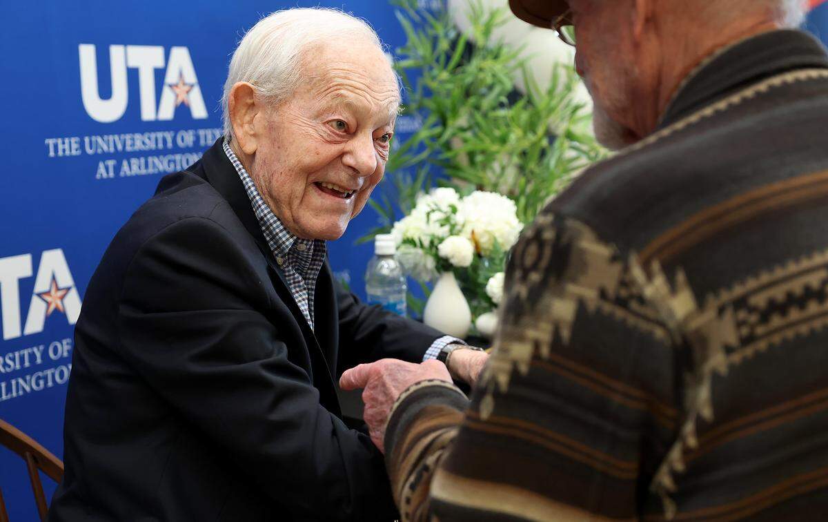 Bob Schieffer signs autographs for fans while attending the public opening of the special collection of his photographs taken for the Fort Worth Star-Telegram during the Vietnam War, called “Our Man In Vietnam,” on Monday, Feb. 9, 2026, at UT Arlington.