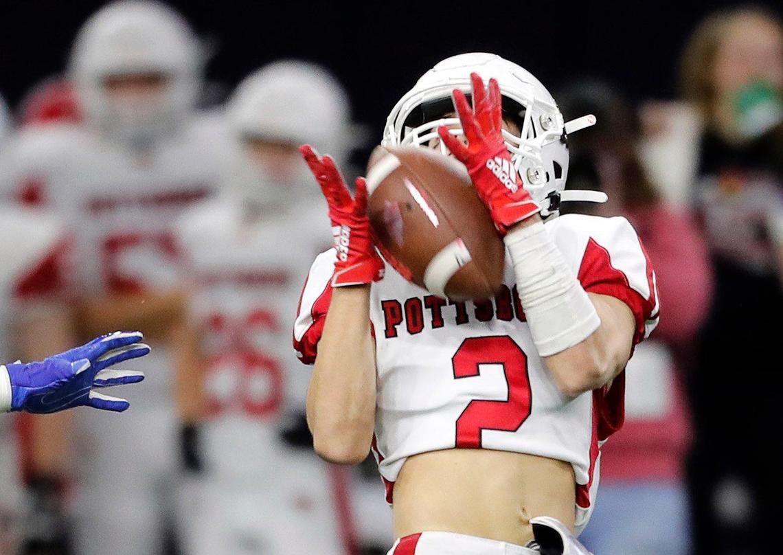 Pottsboro wide receiver Zac Talley (2) hauls in a pass in the first half of the 3A division I state semifinal championship football game at Ford Center in Frisco, Texas, Thursday, Dec. 12, 2019. Brock led 21-17 at the half. (Special to the Star-Telegram Bob Booth)
