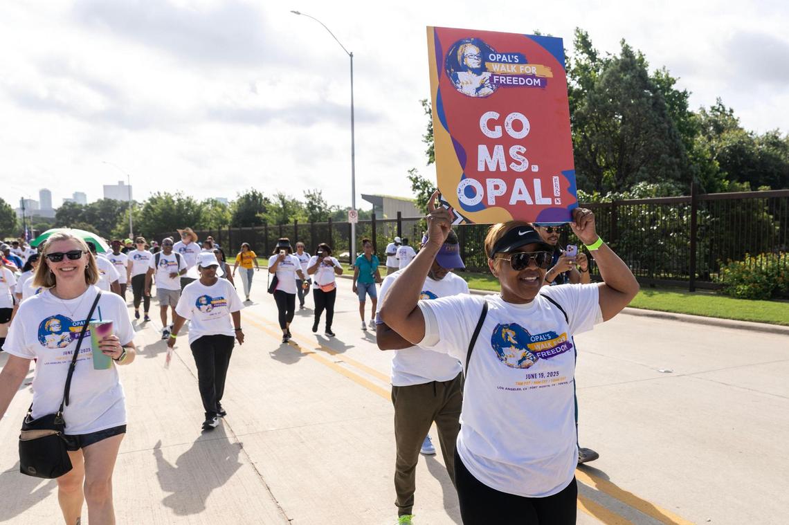 Walk participants walk down Trail Drive for the Opal Lee Walk for Freedom at Farrington Field in Fort Worth on Thursday, June 19, 2025.