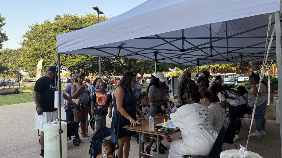 Thousands of North Texas families line up for a chance for their kids to receive free school supplies, backpacks, and a chance to get one of 200 laptops for grades 9 to 12 students at the Tarrant County Back-to-School Roundup event at TCC South Campus.