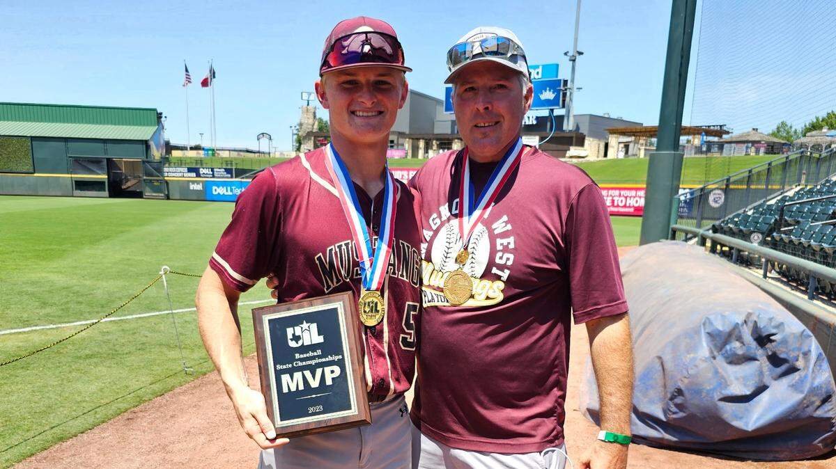 Former Arlington Martin standout Matt Blank, right, who won a state title in 1993 with the Warriors, poses with his son Jackson Blank, left, who was the MVP in Magnolia West’s win in the UIL Class 5A state championship game on Saturday, at Dell Diamond in Round Rock,.